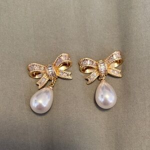 Elegant Gold and Pearl Bow Earrings